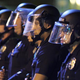 Police officers line up to protect the LAPD headquarters Nov. 25, 2014, in Los Angeles as they face off with protesters after the grand jury decision not to indict Officer Darren Wilson, who shot dead unarmed teen Michael Brown in Ferguson, Mo.
David McNew/Getty Images